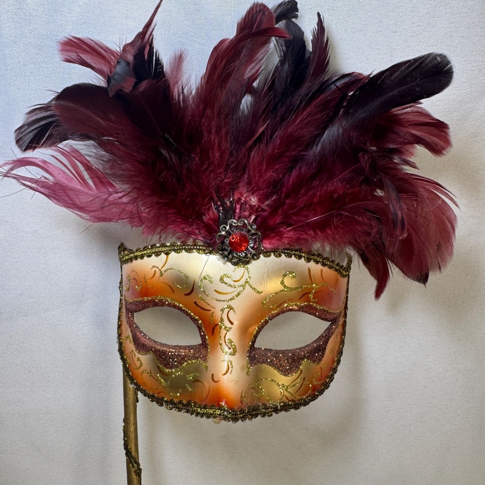 Gold Ombre Masquerade Mask with Burgundy Feathers and Handheld Stick Halloween
